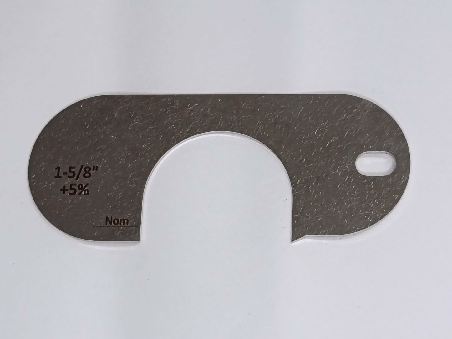 wire rope and sheave gauge on a grey background