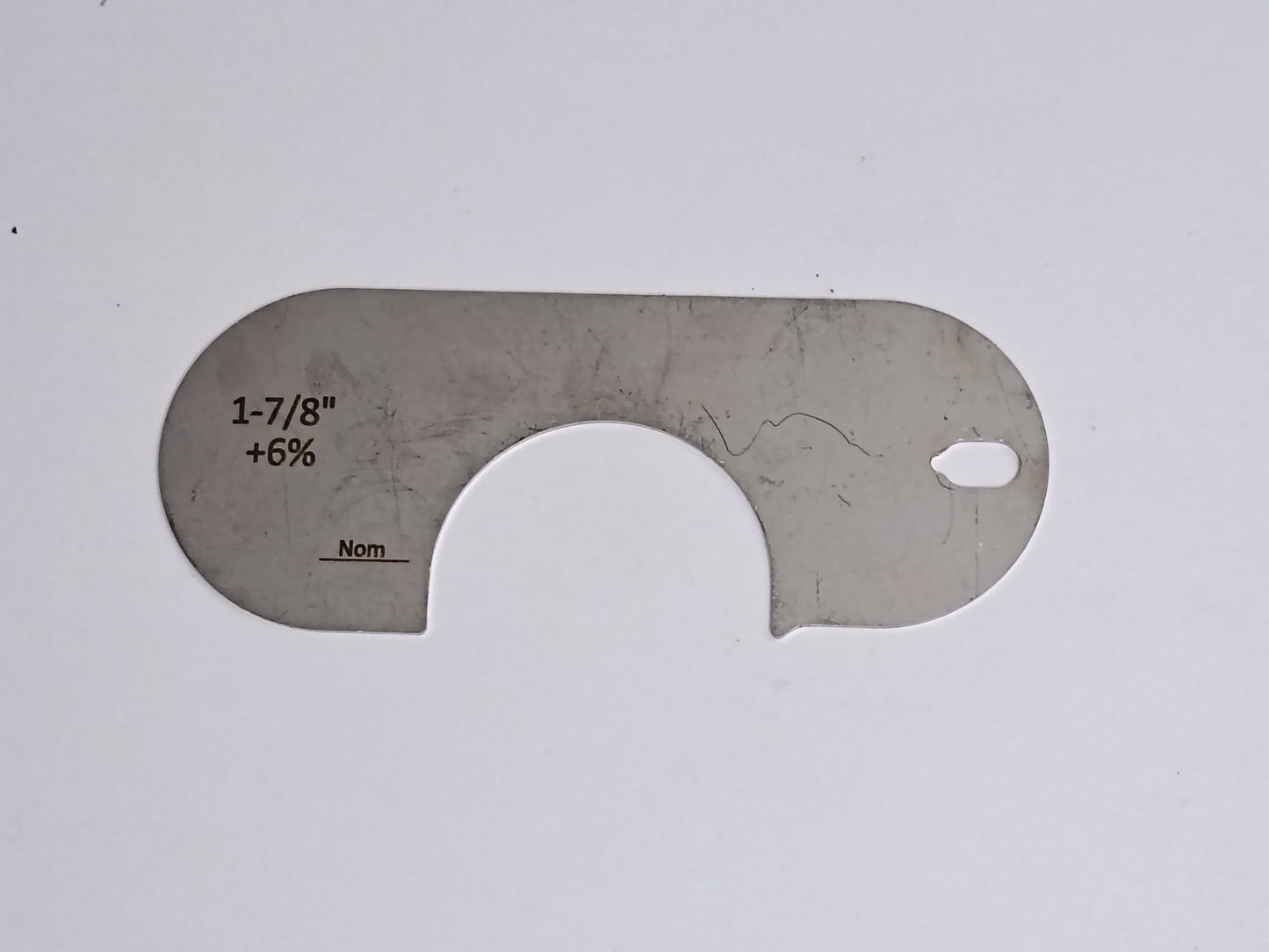 wire rope and sheave gauge on a grey background