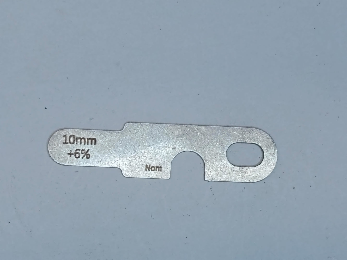 wire rope and sheave gauge on a grey background