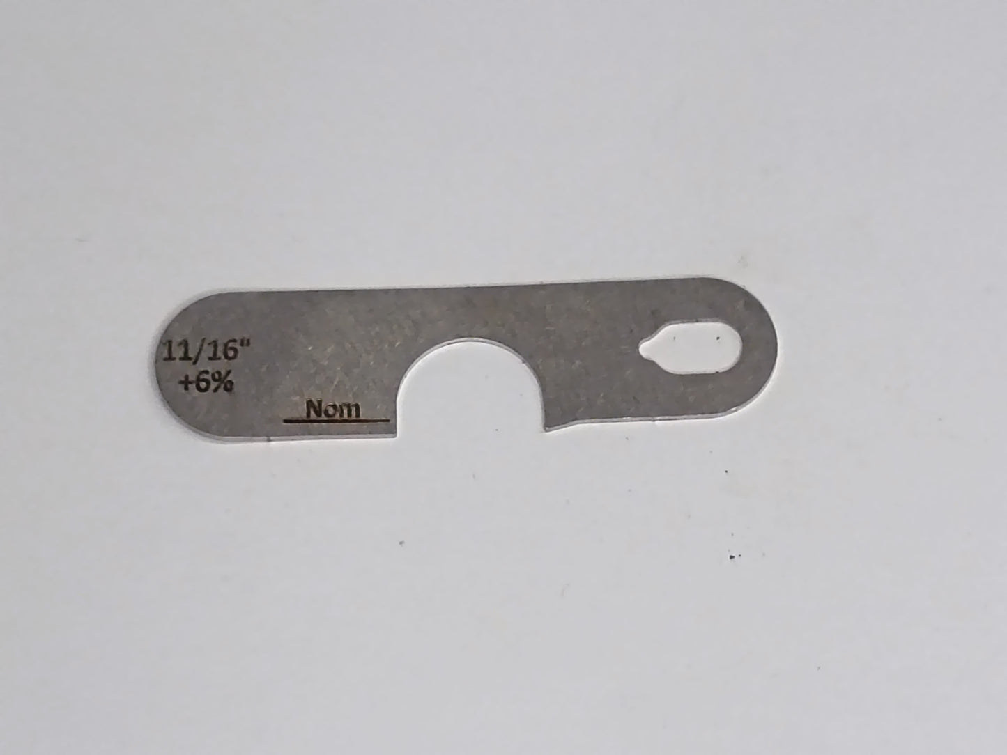 wire rope and sheave gauge on a grey background