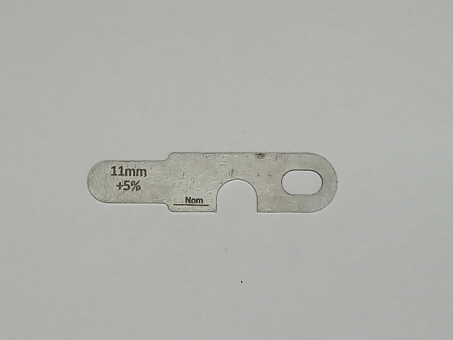 wire rope and sheave gauge on a grey background