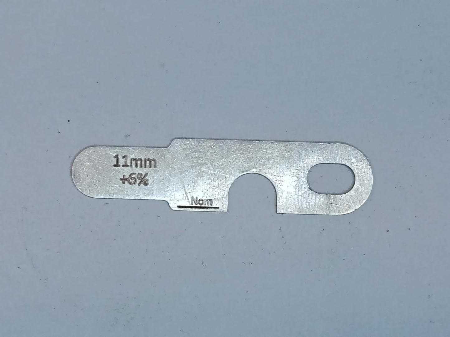 wire rope and sheave gauge on a grey background