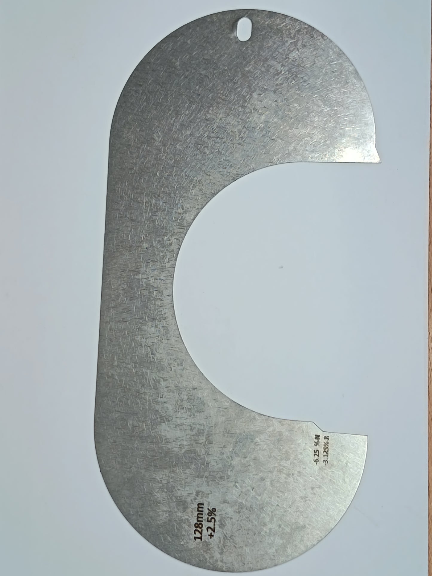wire rope and sheave gauge on a grey background