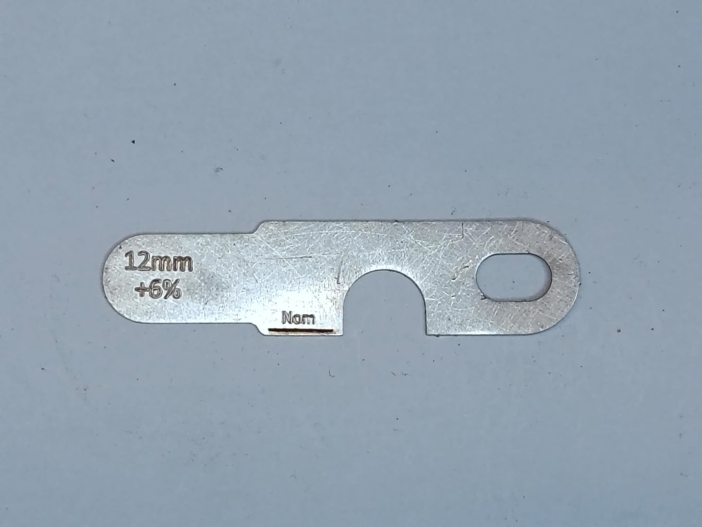 wire rope and sheave gauge on a grey background