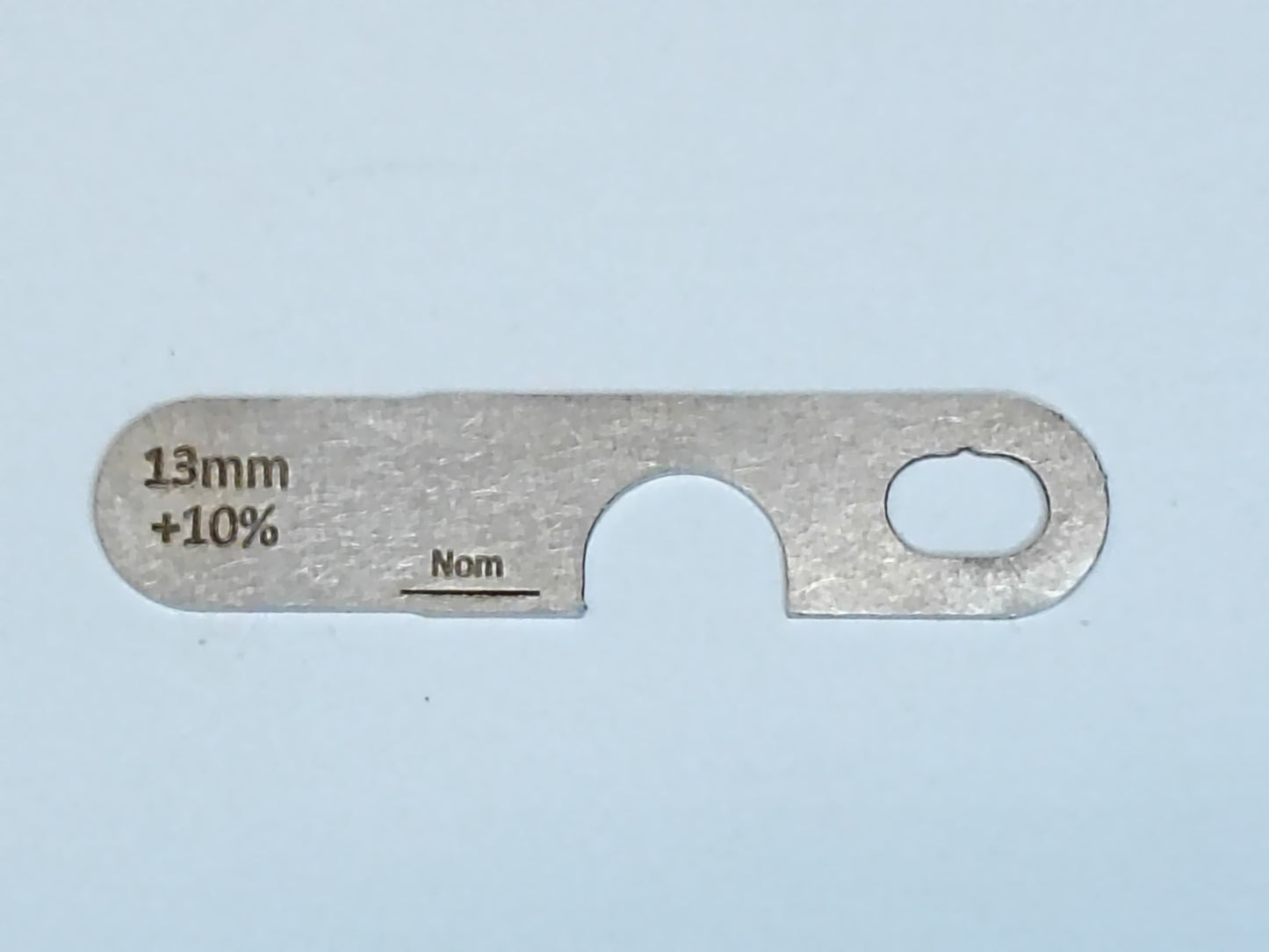 wire rope and sheave gauge on a grey background