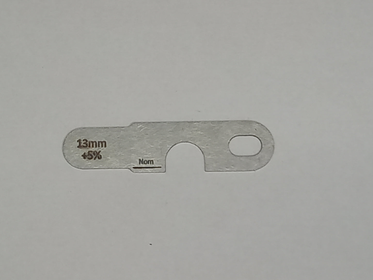 wire rope and sheave gauge on a grey background