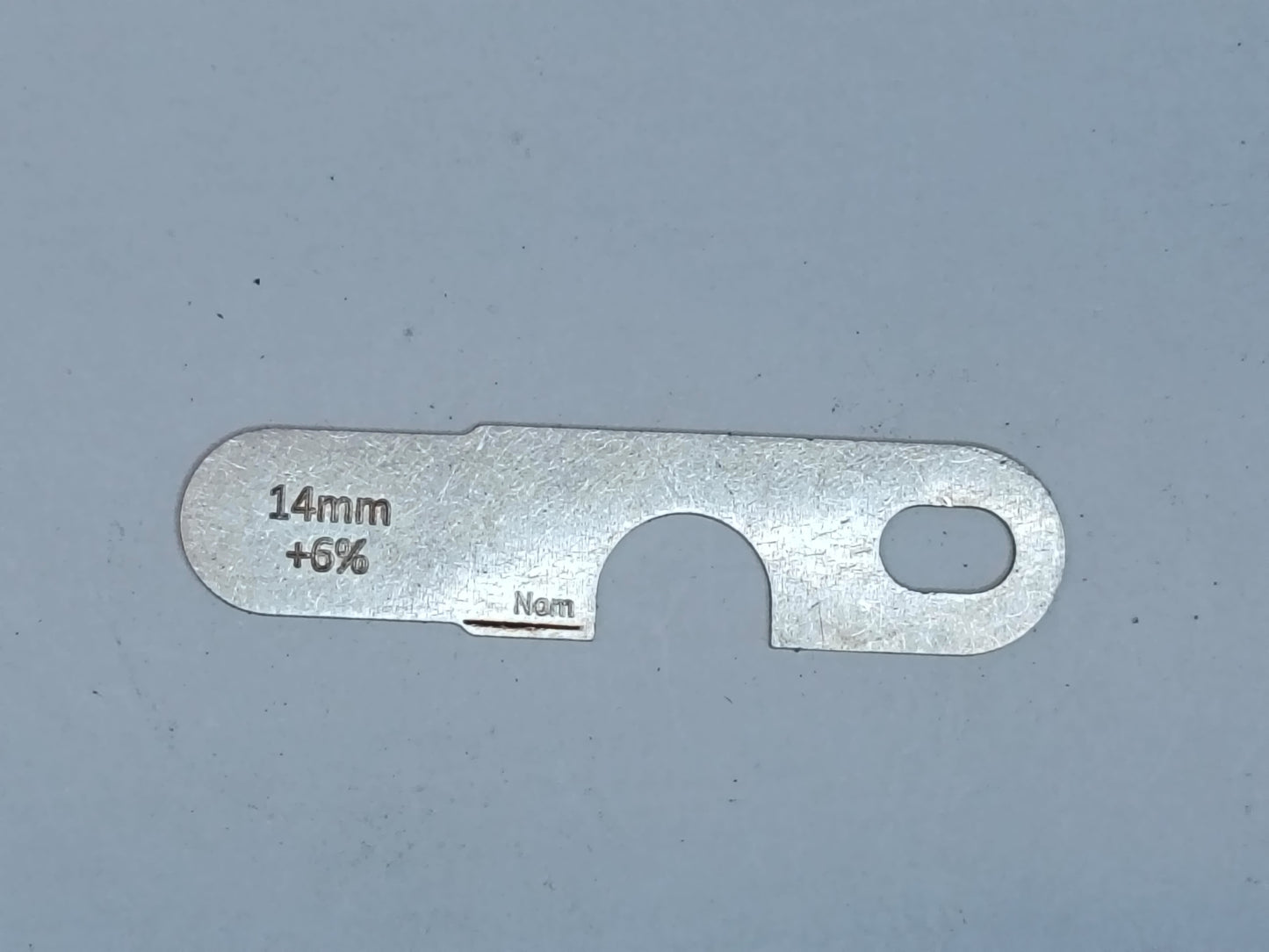 wire rope and sheave gauge on a grey background