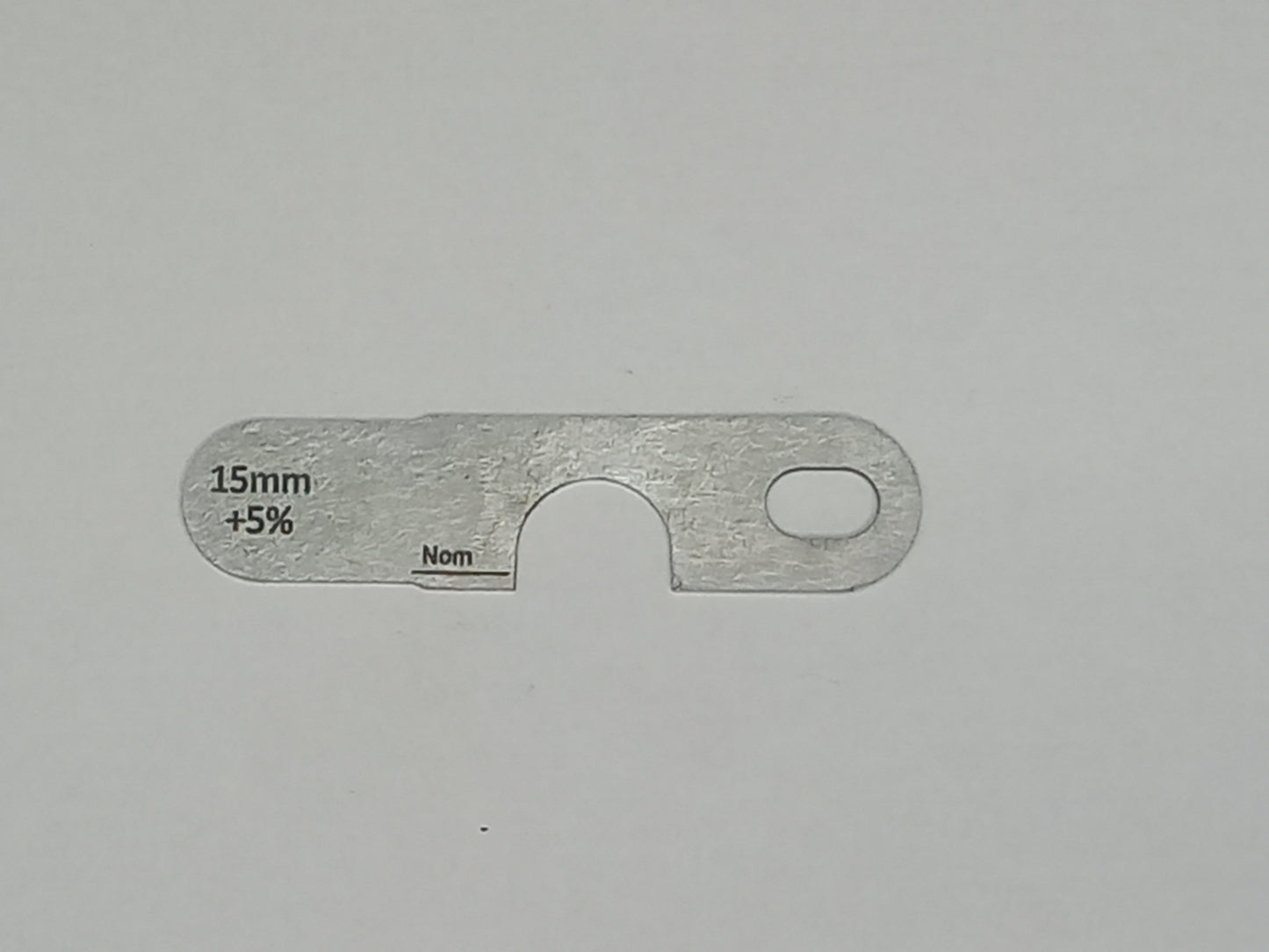 wire rope and sheave gauge on a grey background