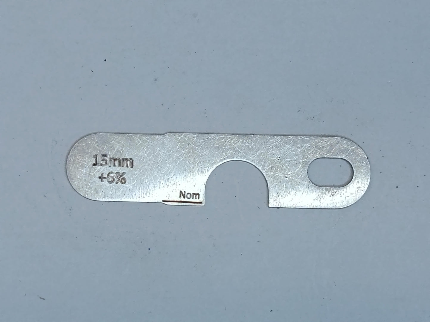 wire rope and sheave gauge on a grey background