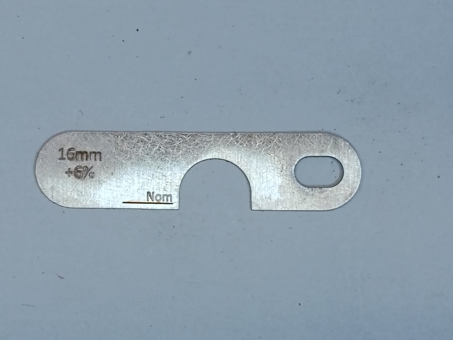 wire rope and sheave gauge on a grey background