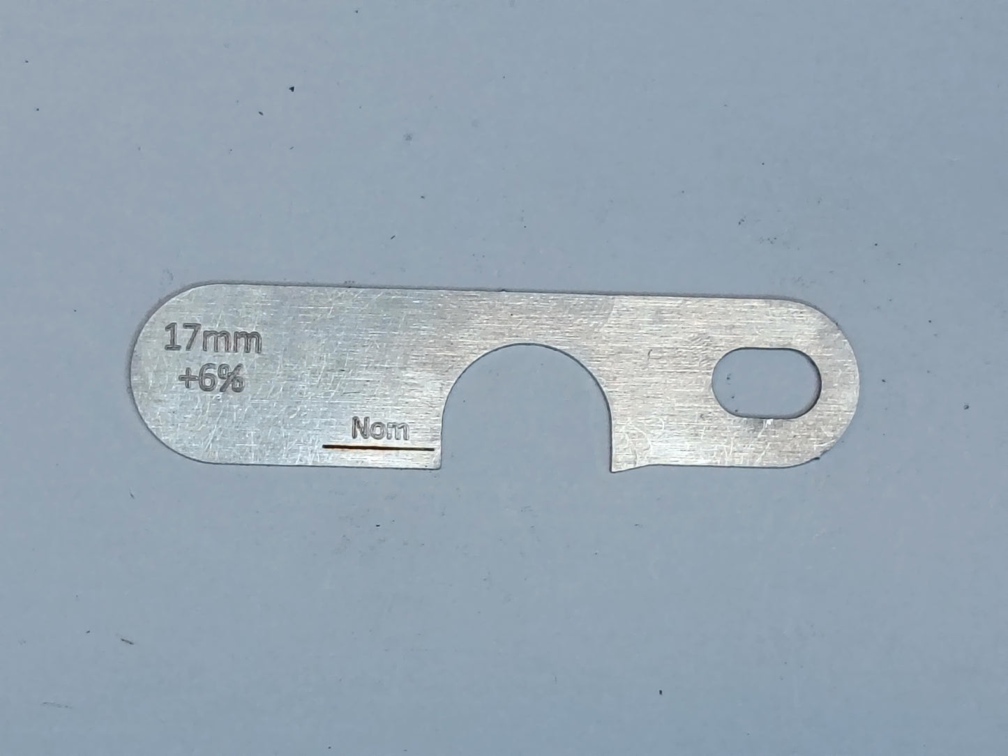 wire rope and sheave gauge on a grey background
