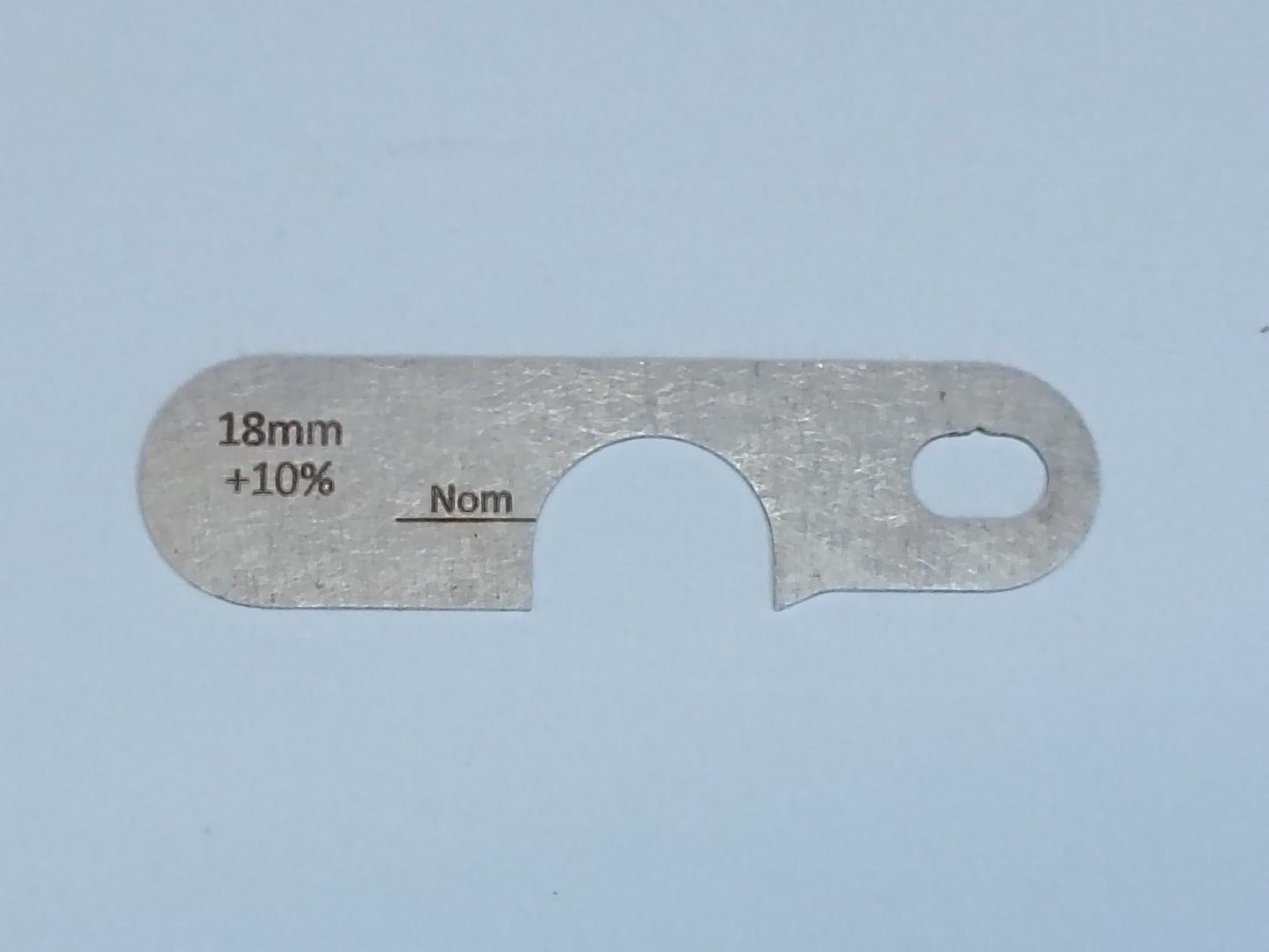 wire rope and sheave gauge on a grey background