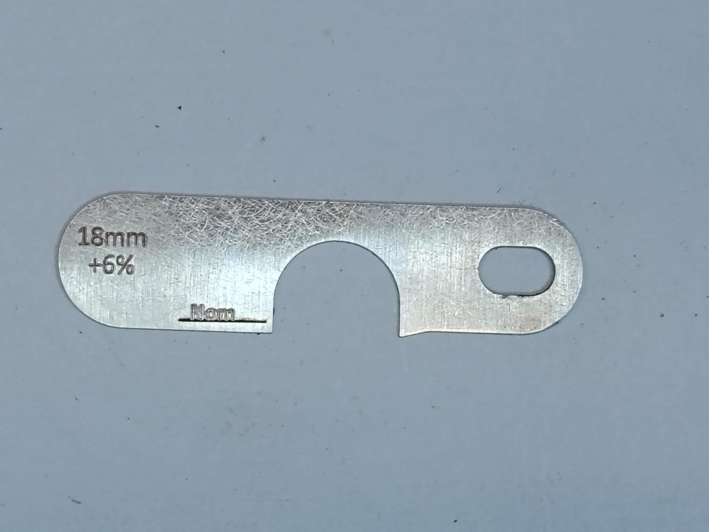 wire rope and sheave gauge on a grey background