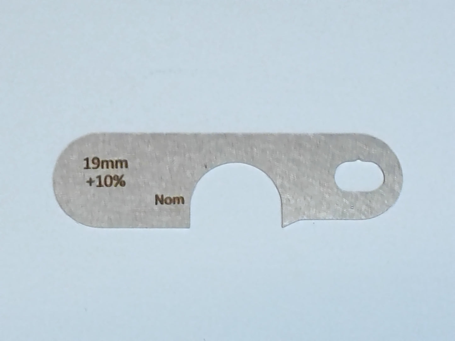 wire rope and sheave gauge on a grey background