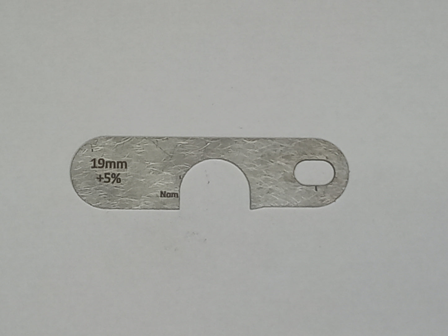 wire rope and sheave gauge on a grey background