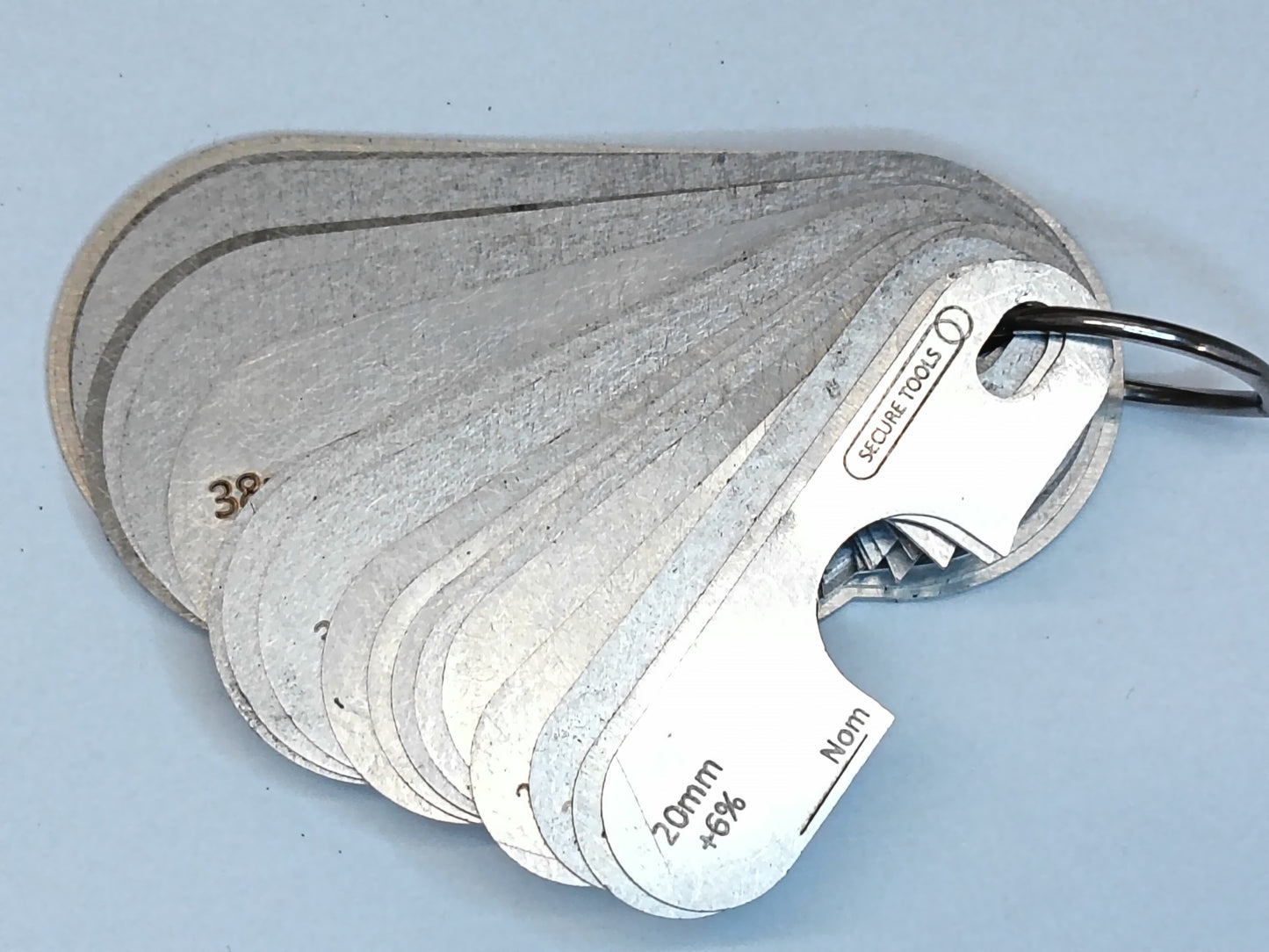 wire rope and sheave gauge on a grey background