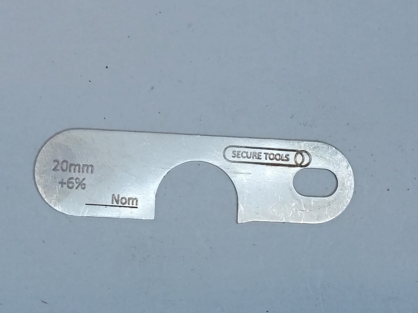 wire rope and sheave gauge on a grey background