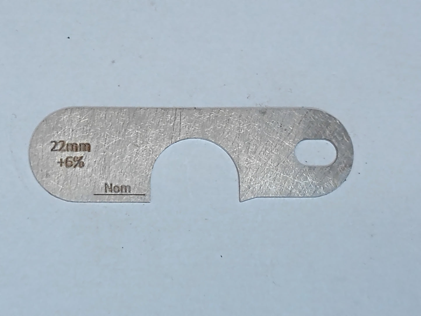 wire rope and sheave gauge on a grey background