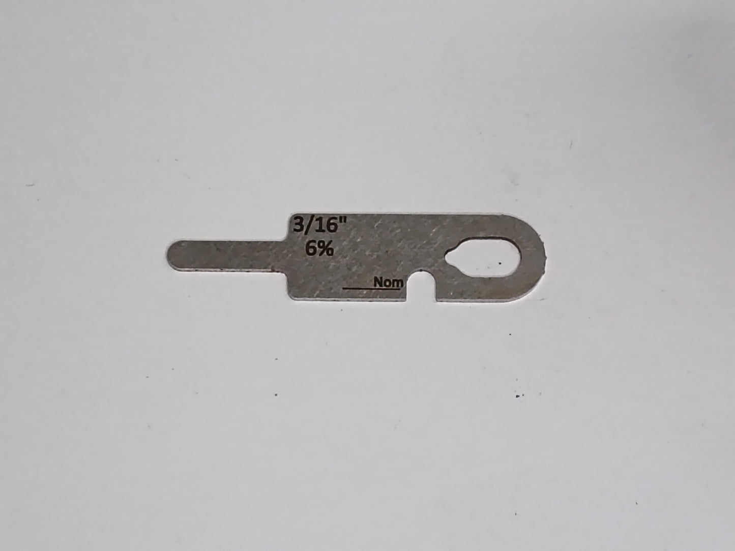 wire rope and sheave gauge on a grey background