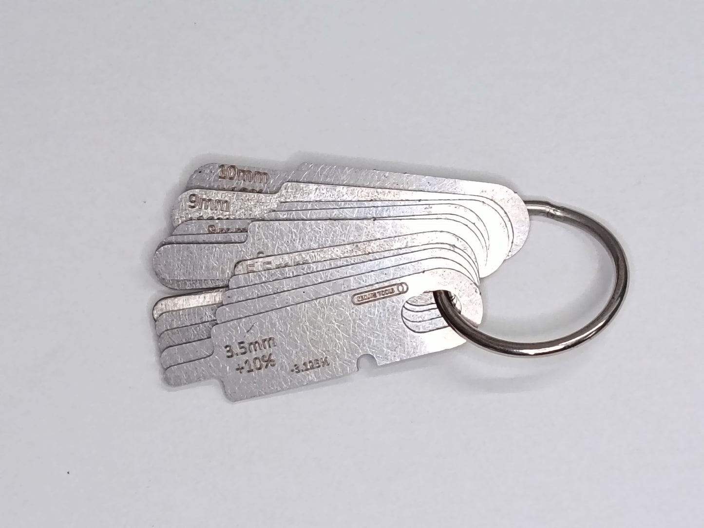 wire rope and sheave gauge on a grey background