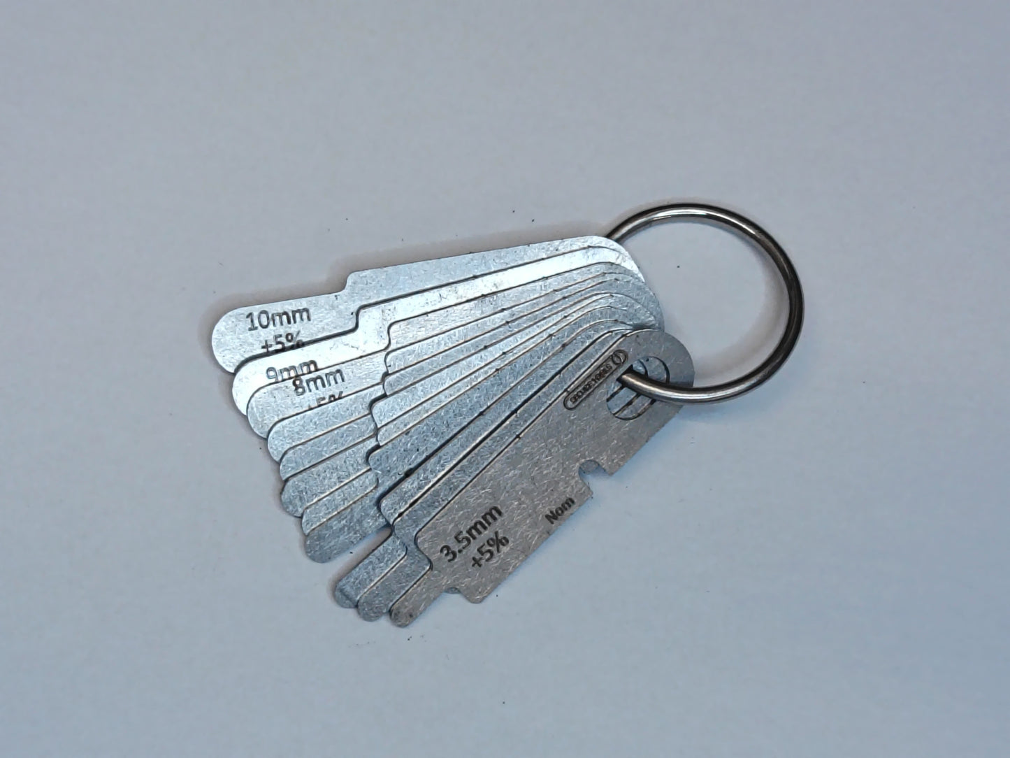 wire rope and sheave gauge on a grey background