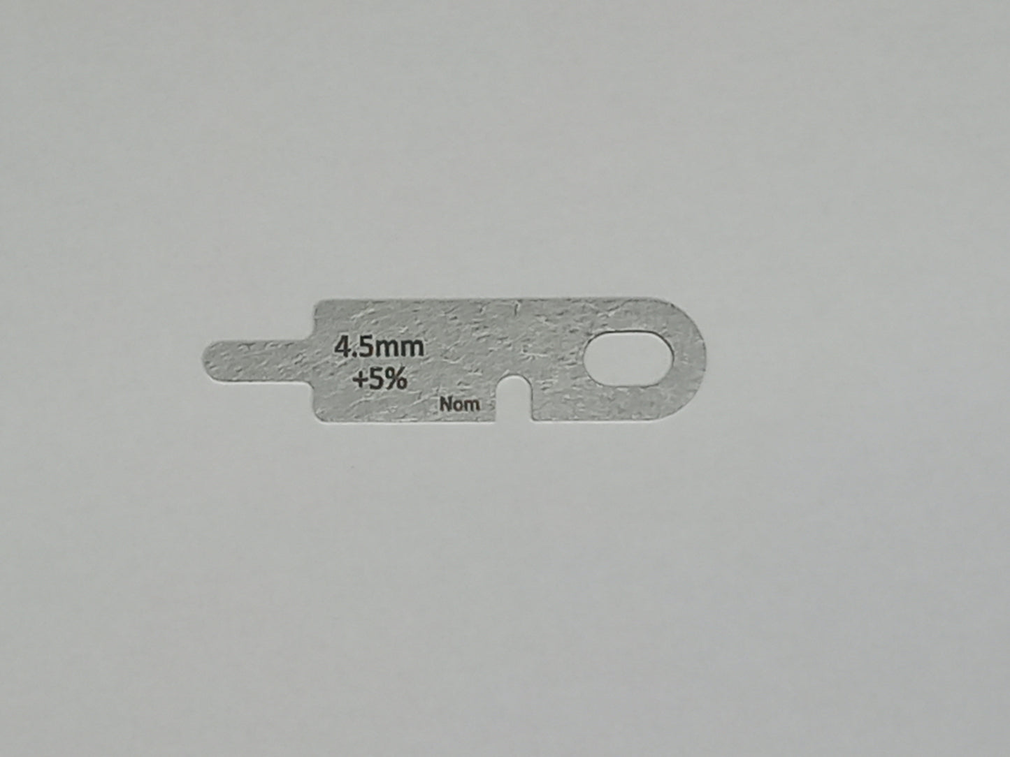 wire rope and sheave gauge on a grey background