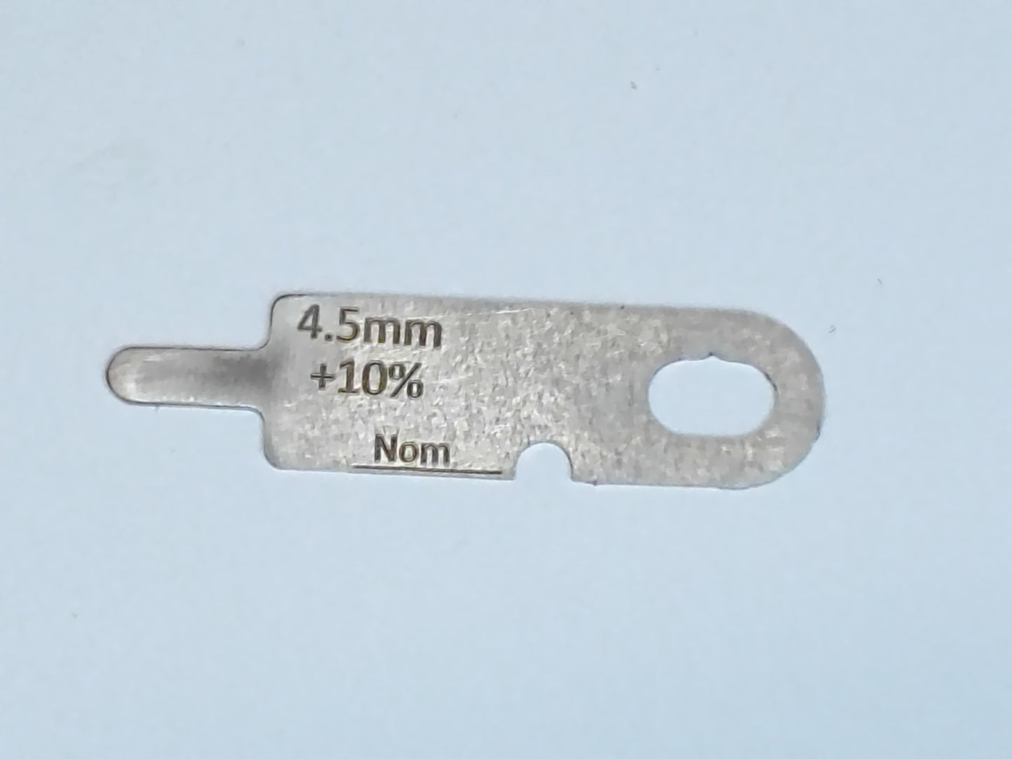 wire rope and sheave gauge on a grey background