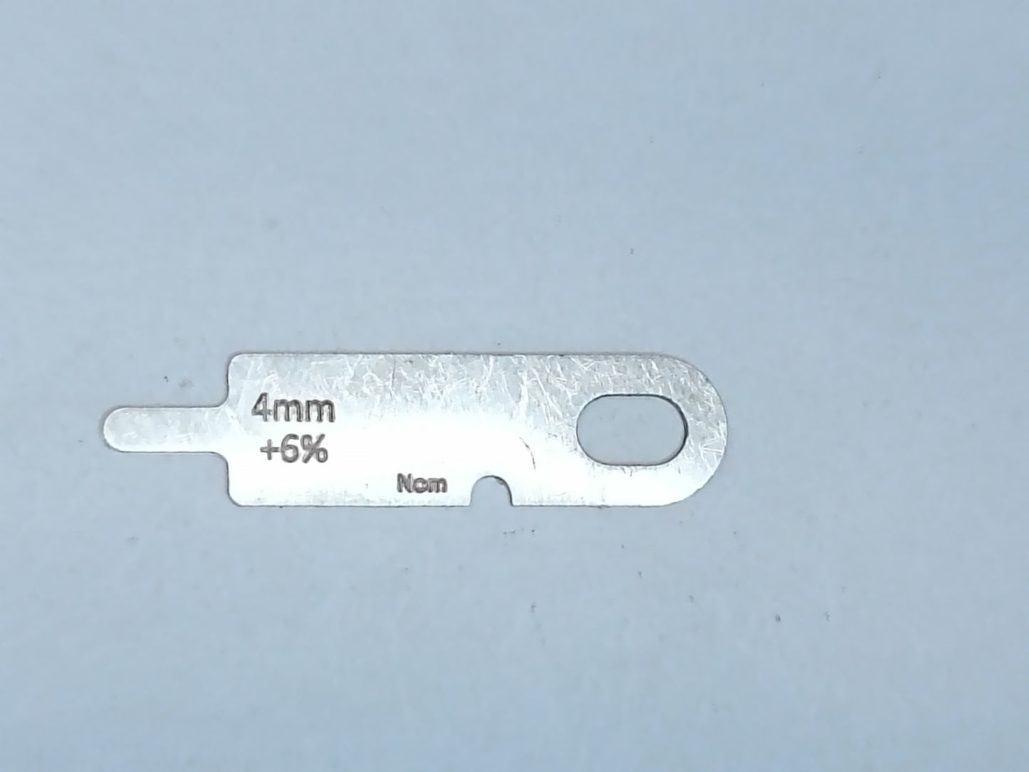 wire rope and sheave gauge on a grey background