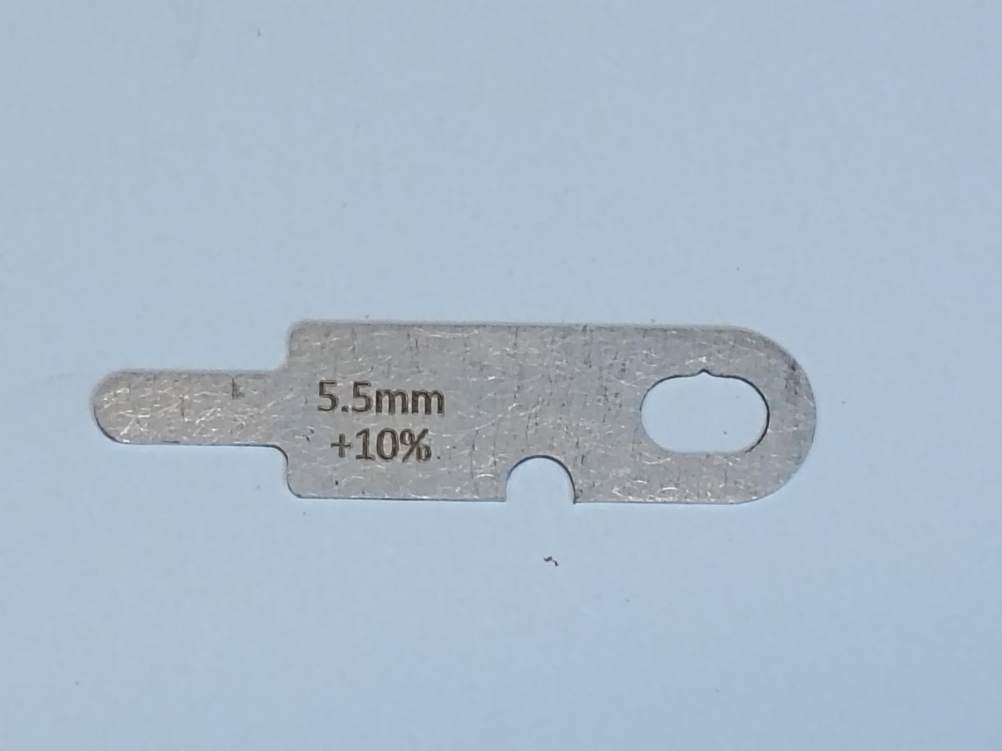wire rope and sheave gauge on a grey background