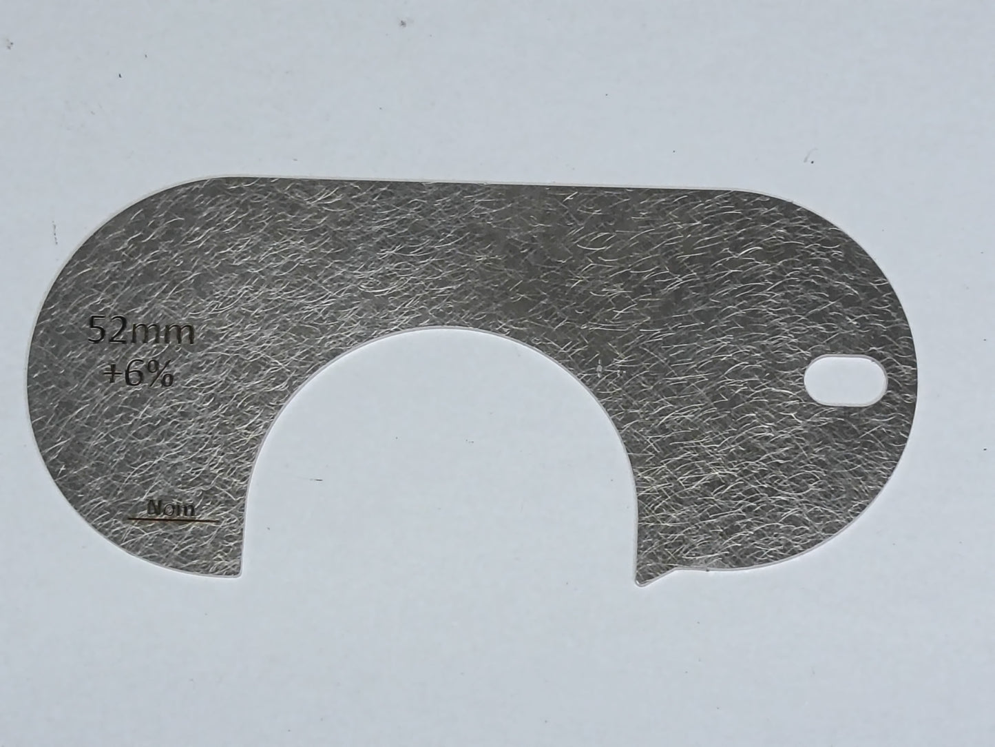 wire rope and sheave gauge on a grey background