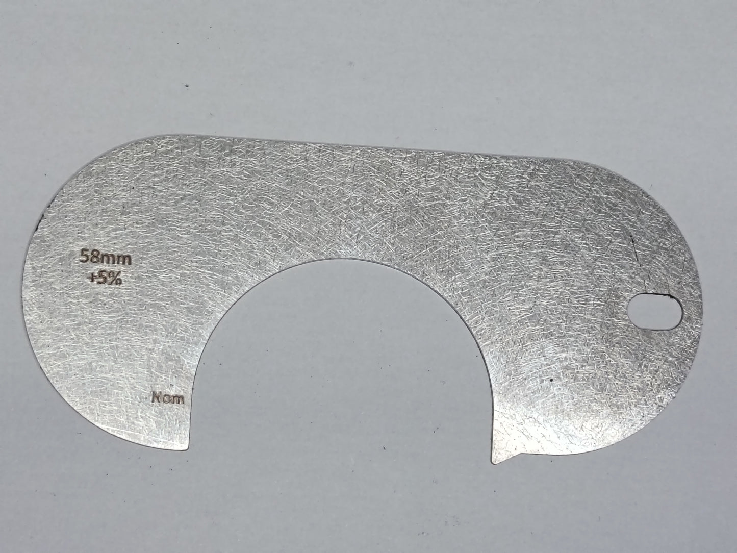 wire rope and sheave gauge on a grey background