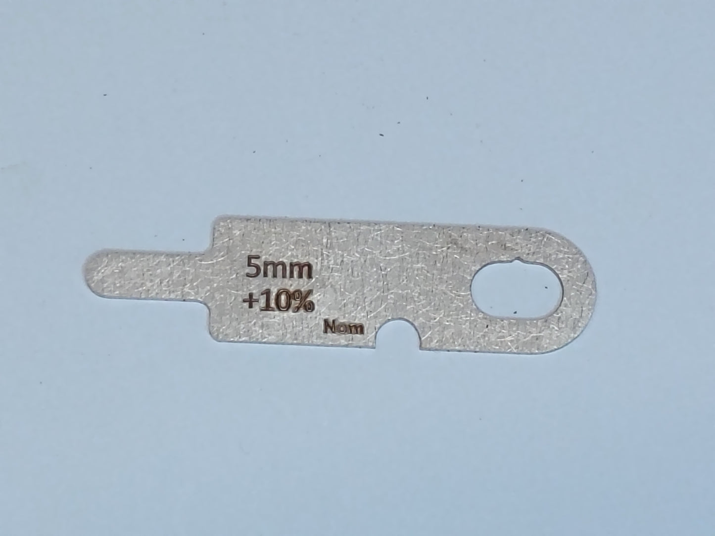 wire rope and sheave gauge on a grey background