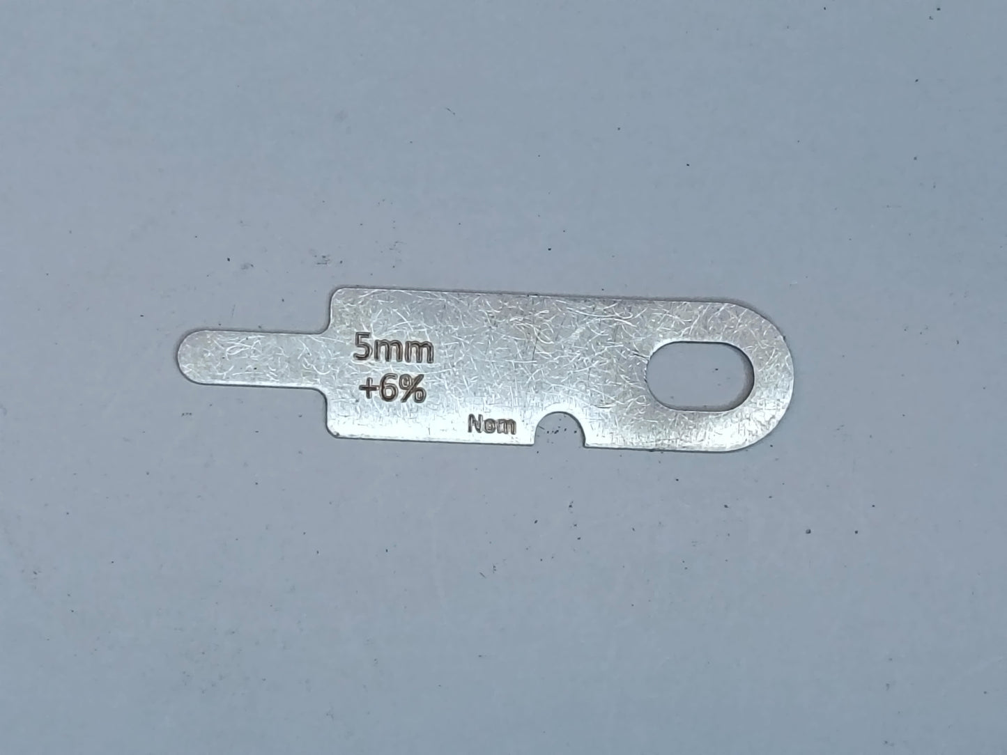 wire rope and sheave gauge on a grey background