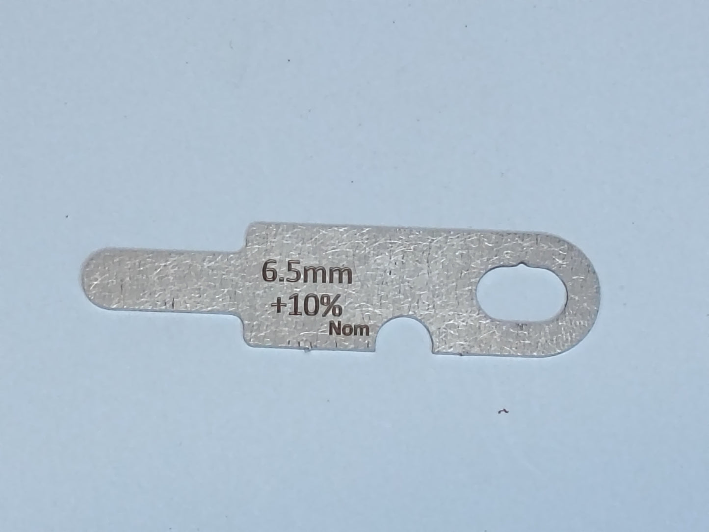 wire rope and sheave gauge on a grey background