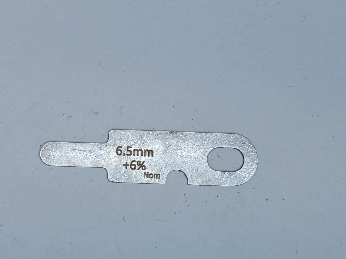 wire rope and sheave gauge on a grey background