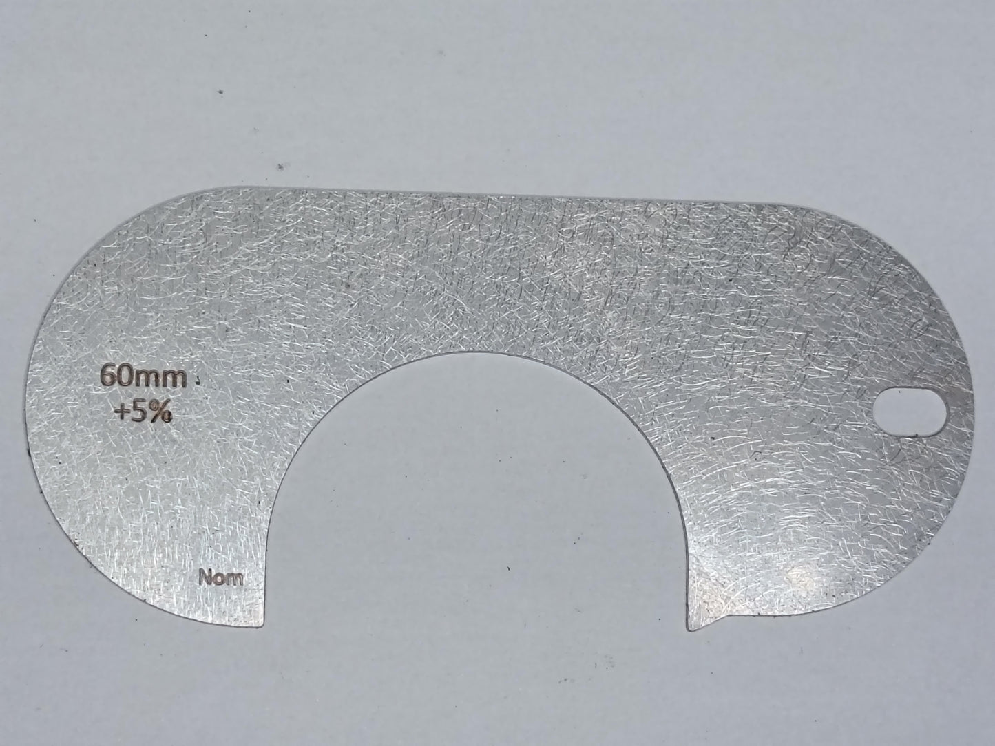 wire rope and sheave gauge on a grey background