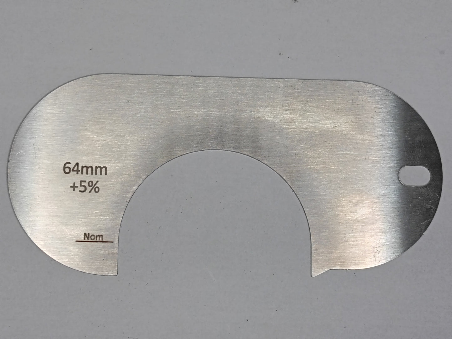 wire rope and sheave gauge on a grey background