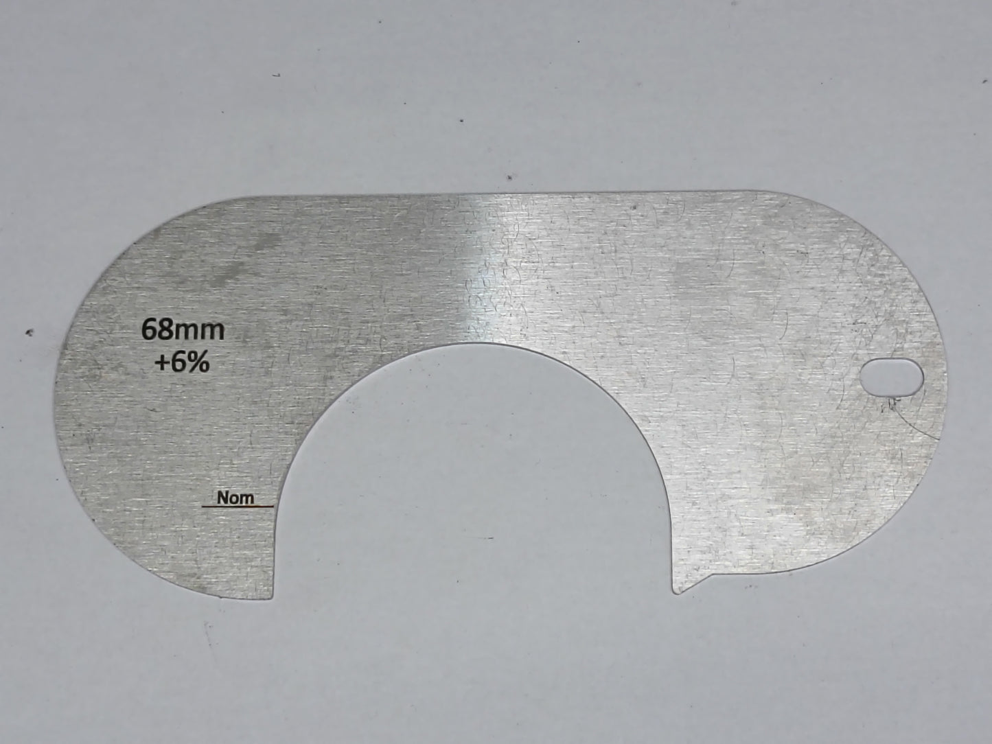 wire rope and sheave gauge on a grey background