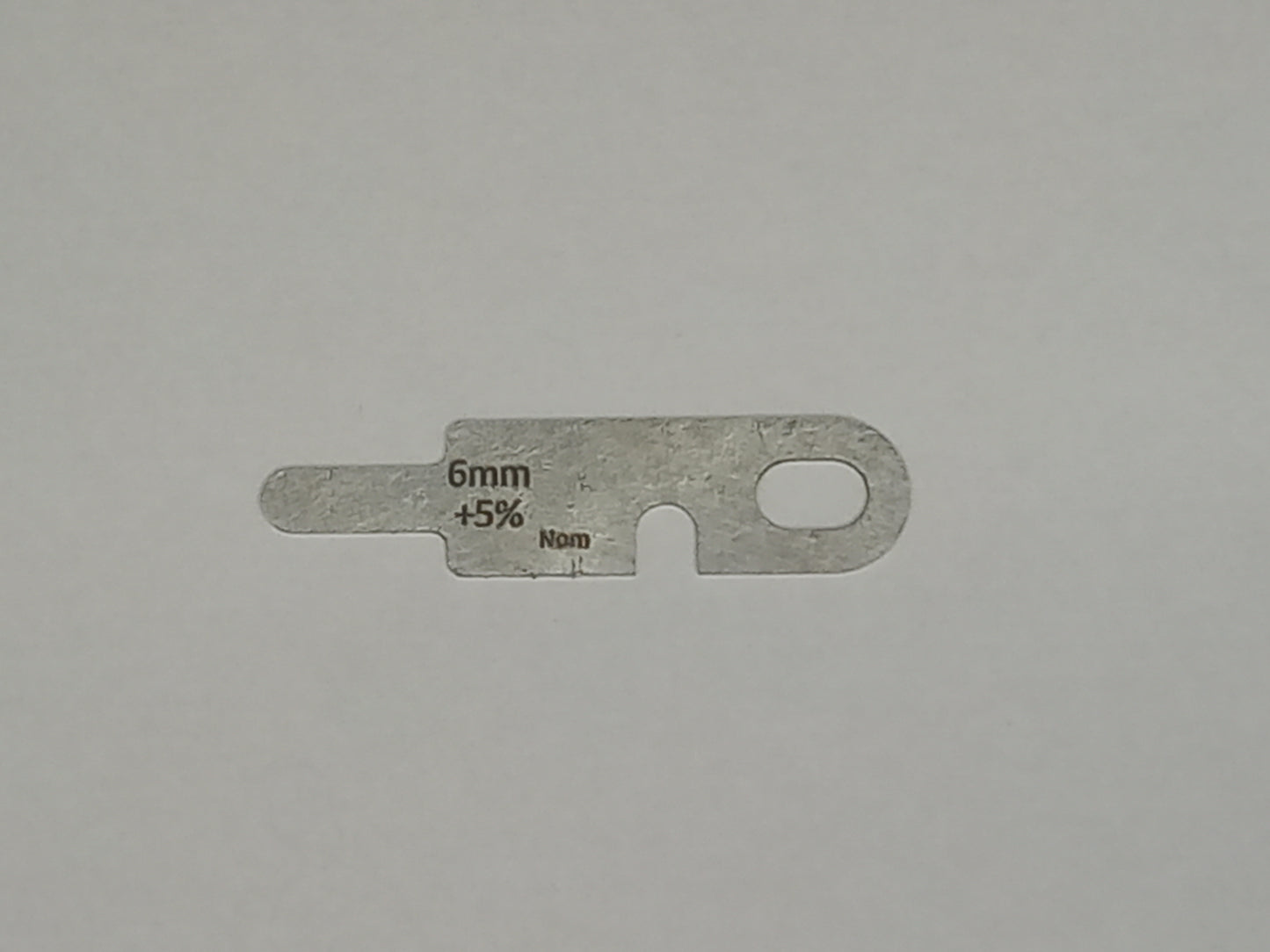 wire rope and sheave gauge on a grey background