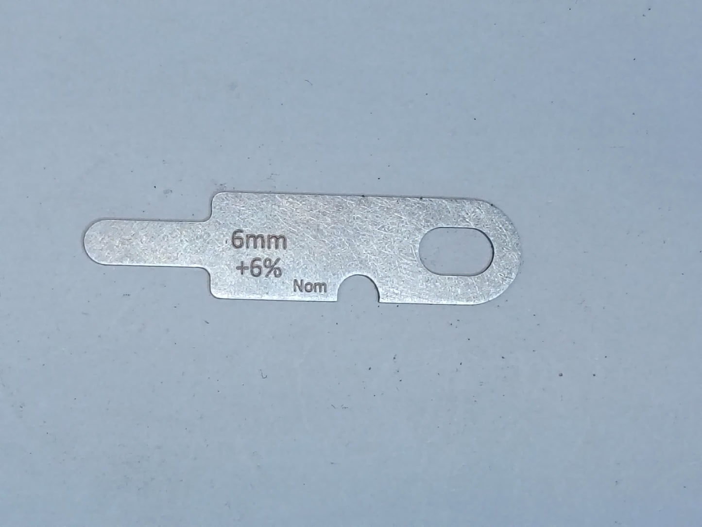 wire rope and sheave gauge on a grey background
