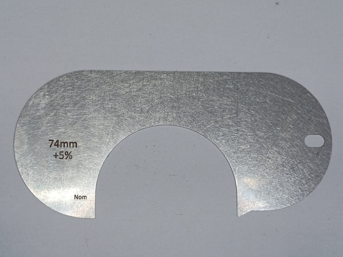 wire rope and sheave gauge on a grey background