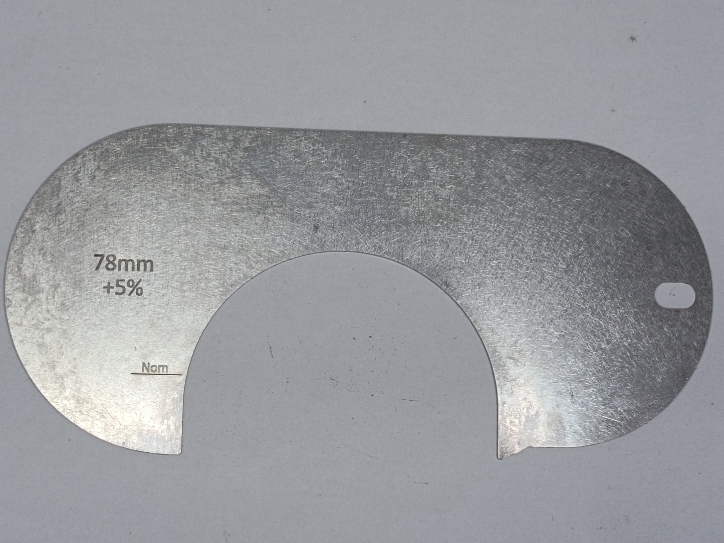 wire rope and sheave gauge on a grey background