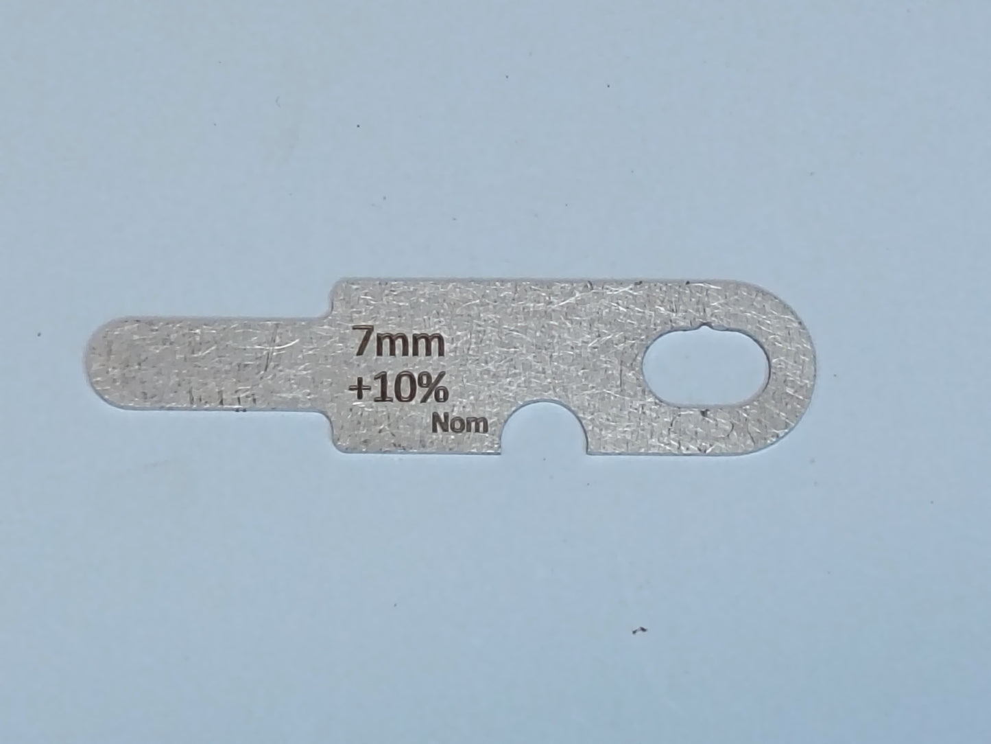 wire rope and sheave gauge on a grey background