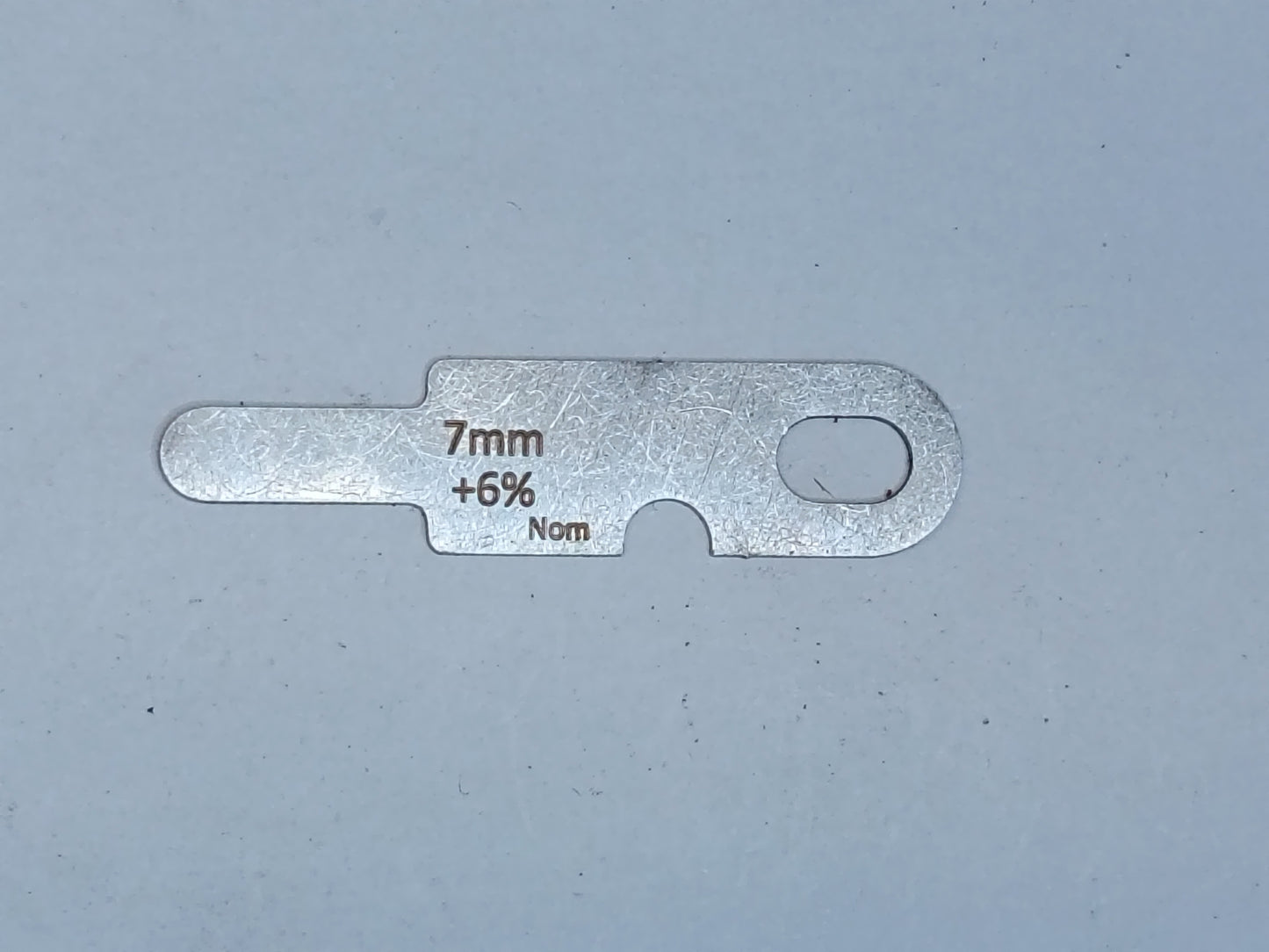 wire rope and sheave gauge on a grey background