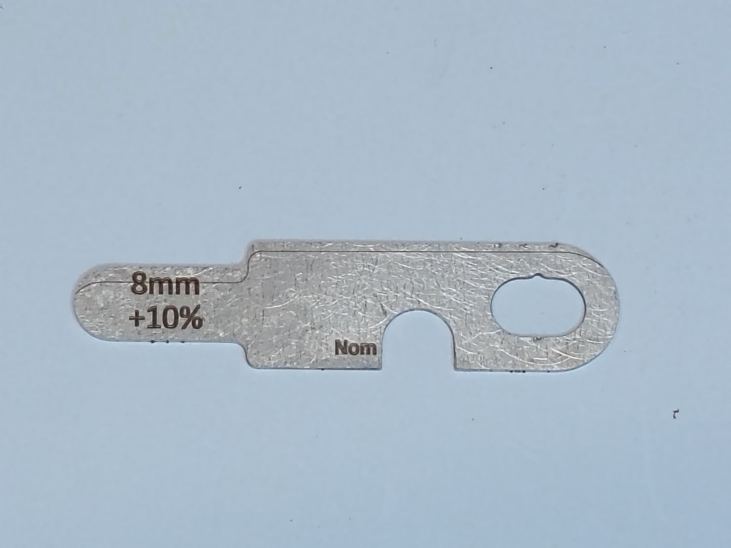 wire rope and sheave gauge on a grey background