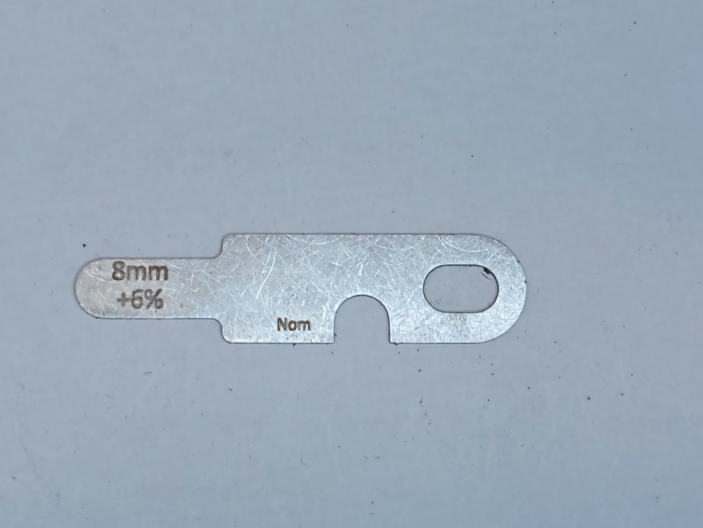wire rope and sheave gauge on a grey background