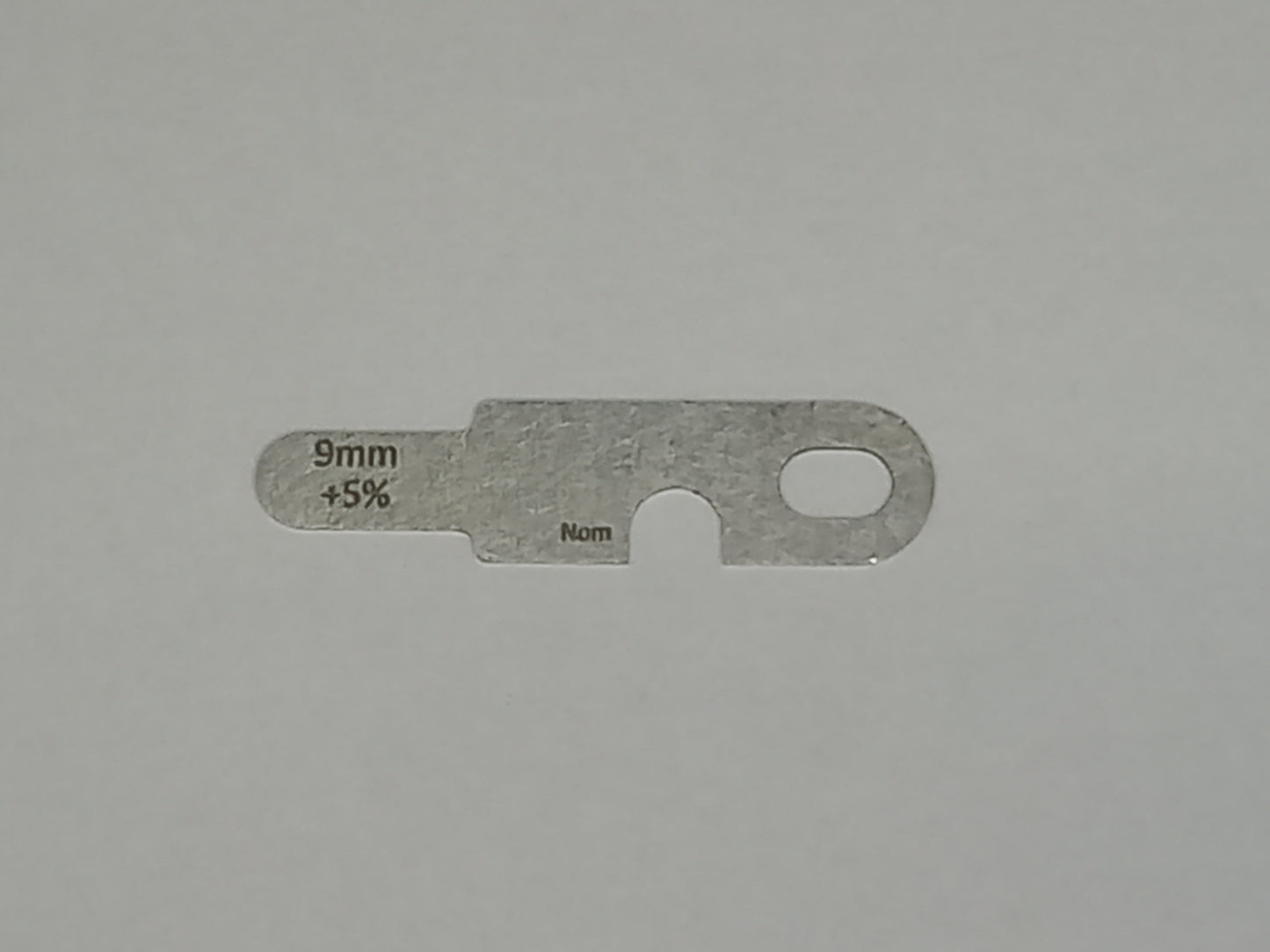 wire rope and sheave gauge on a grey background