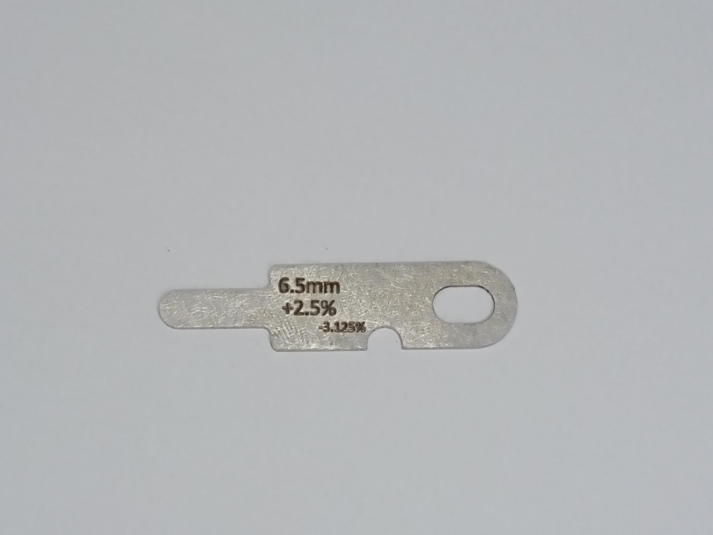 wire rope and sheave gauge on a grey background