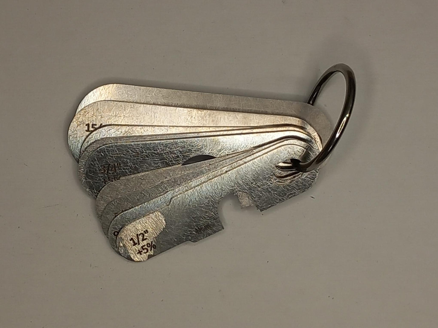 wire rope and sheave gauge  on a grey background